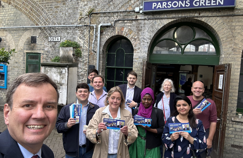 Greg Hands with Conservative supporters outside Parsons Green Tube Station.